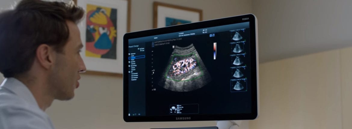 doctor looking at the imaging of an ultrasonic scan